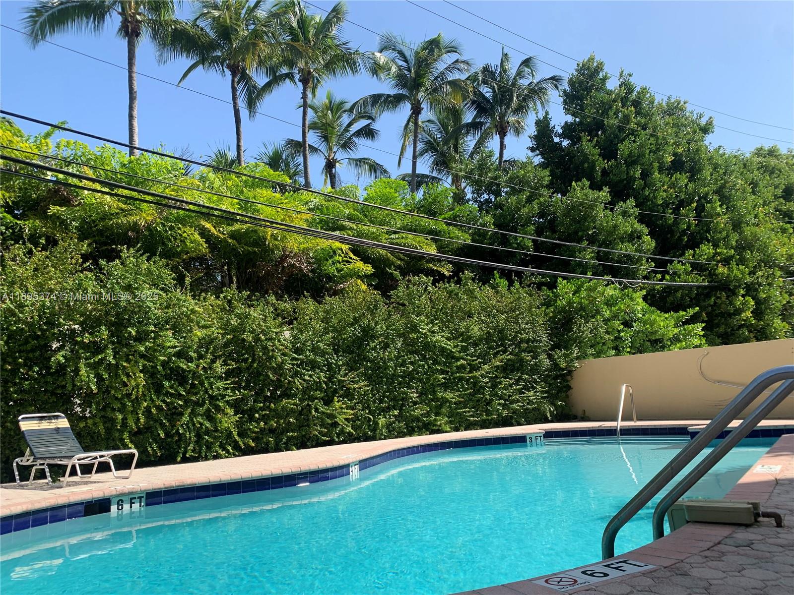 555 Crandon Boulevard, Unit 53 Key Biscayne, FL 33149 - Photo 31 of 33 a view of a yard with a table and chair