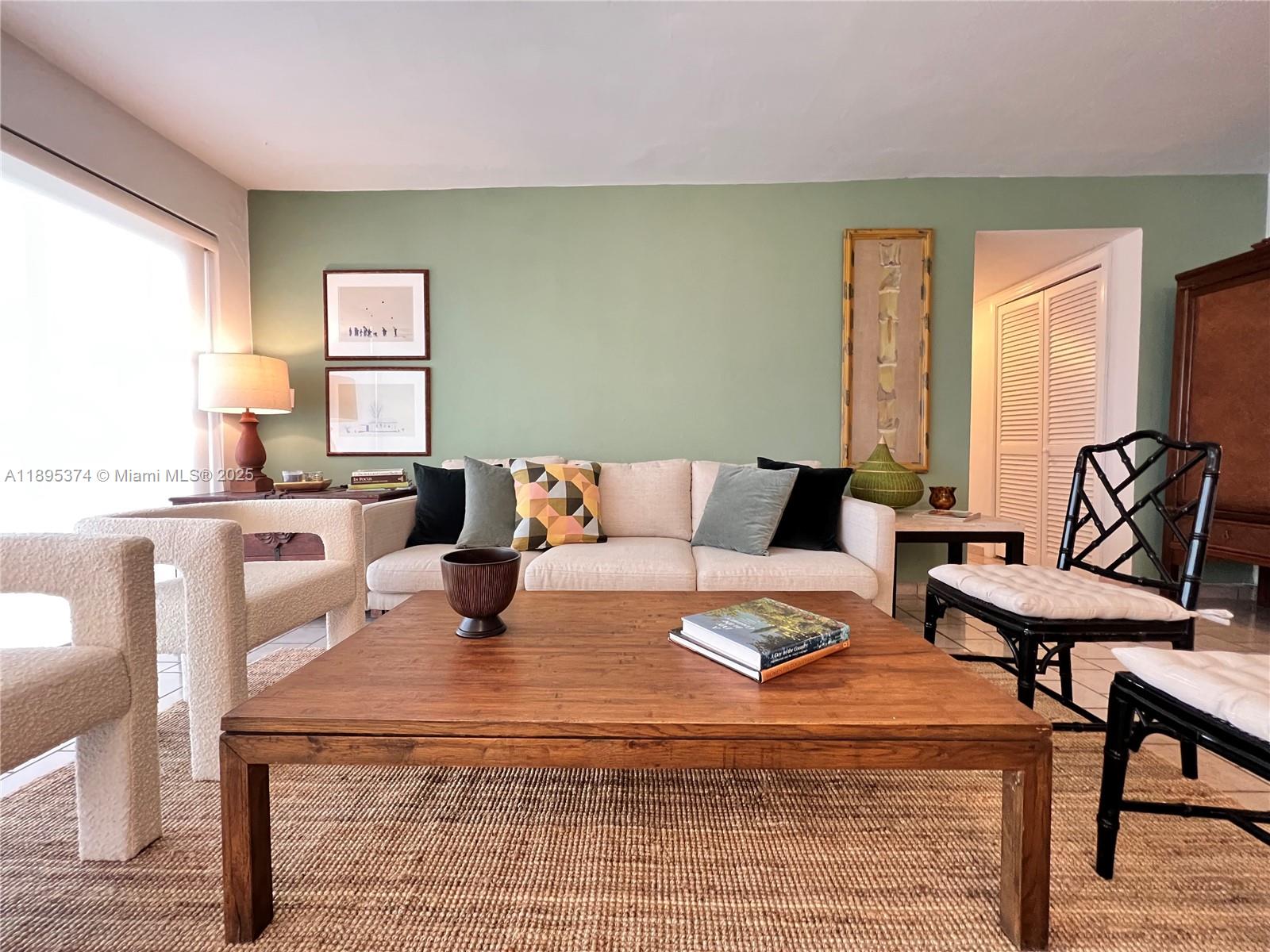 555 Crandon Boulevard, Unit 53 Key Biscayne, FL 33149 - Photo 4 of 33 a bedroom with a bed and wooden floor