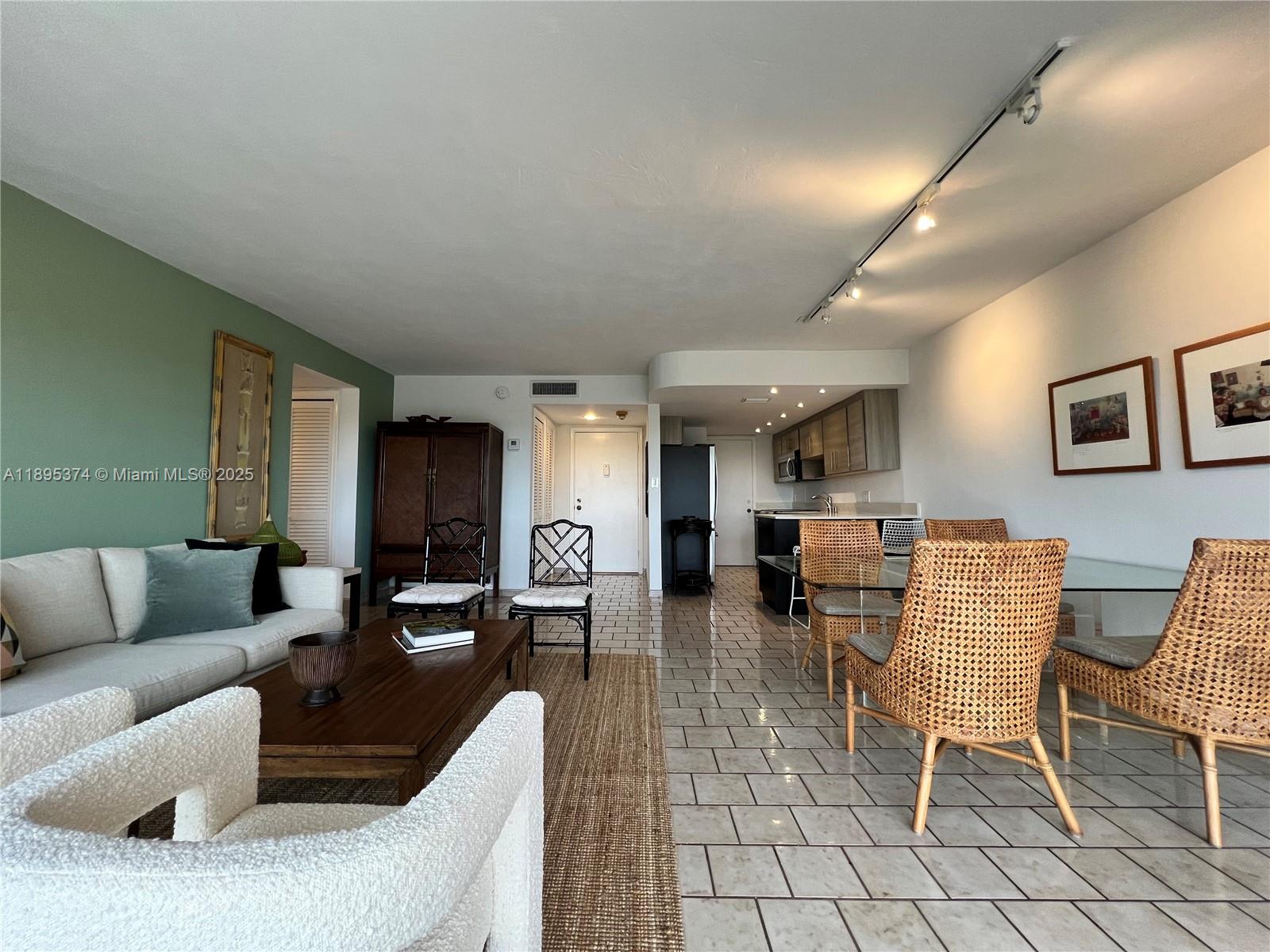 555 Crandon Boulevard, Unit 53 Key Biscayne, FL 33149 - Photo 7 of 33 a living room with furniture and a couch