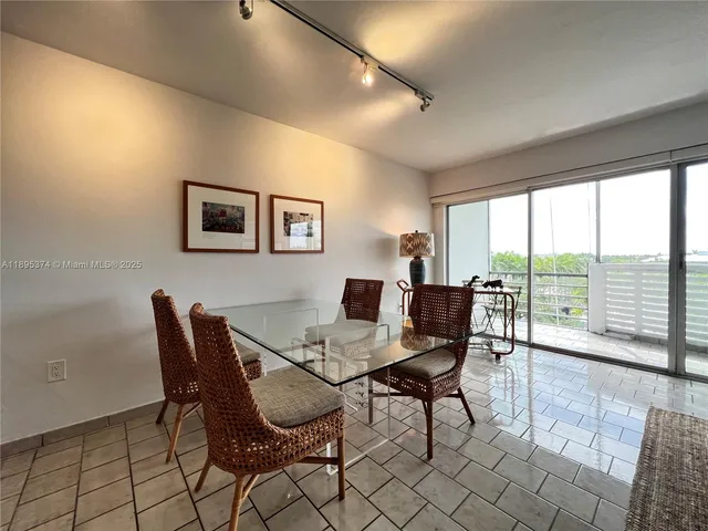 a view of a livingroom with furniture and dining room