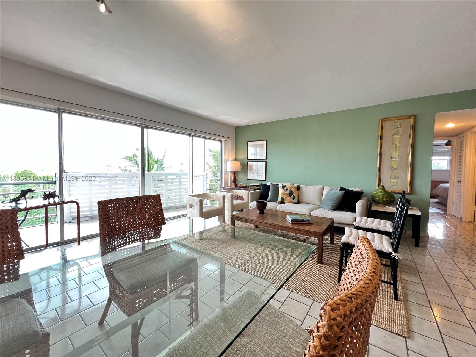 555 Crandon Boulevard, Unit 53 Key Biscayne, FL 33149 - Photo 10 of 33 a living room with furniture and large windows