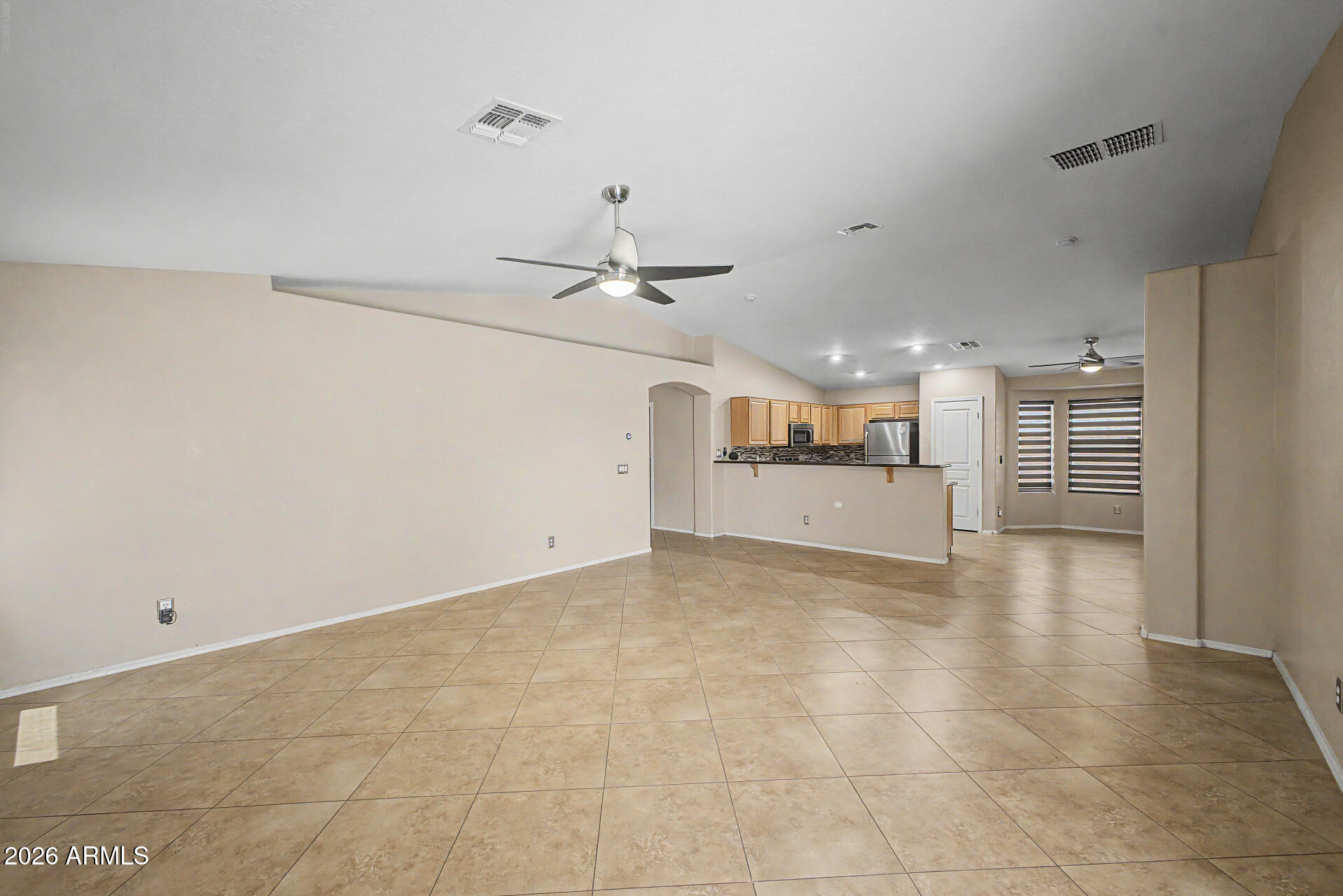 2340 West Apollo Road Phoenix, AZ 85041 - Photo 4 of 26 a view of a kitchen with a sink and a refrigerator