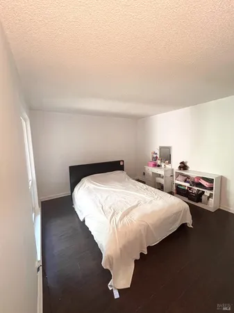 a bedroom with bed and a window