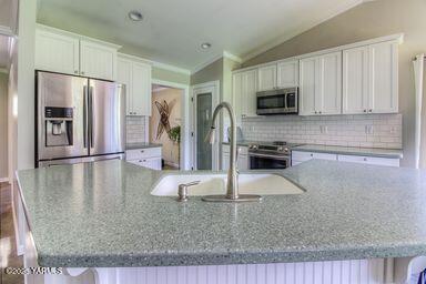 121 Rattlesnake Lane Naches, WA 98937 - Photo 13 of 45 a kitchen with stainless steel appliances granite countertop a refrigerator a stove and a sink