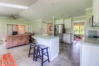 121 Rattlesnake Lane Naches, WA 98937 - Photo 16 of 45 a kitchen with kitchen island a counter top space a sink stainless steel appliances and cabinets