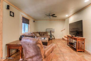 121 Rattlesnake Lane Naches, WA 98937 - Photo 31 of 45 a living room with furniture and a flat screen tv