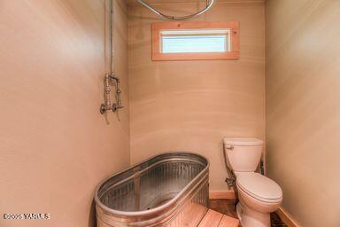 121 Rattlesnake Lane Naches, WA 98937 - Photo 35 of 45 a white toilet sitting next to a shower
