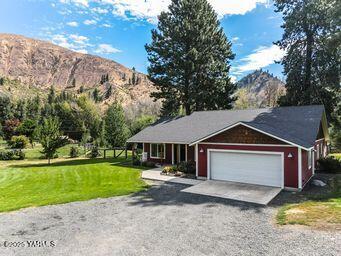 121 Rattlesnake Lane Naches, WA 98937 - Photo 41 of 45 a front view of a house with garden