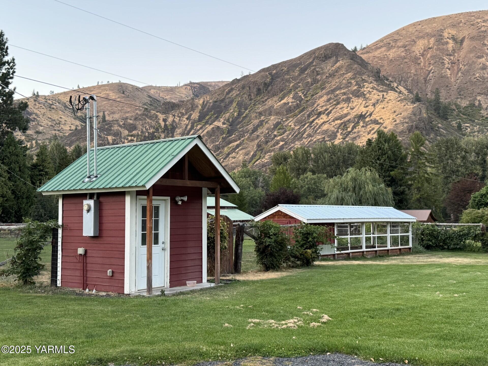121 Rattlesnake Lane Naches, WA 98937 - Photo 8 of 45 a front view of a house with a garden