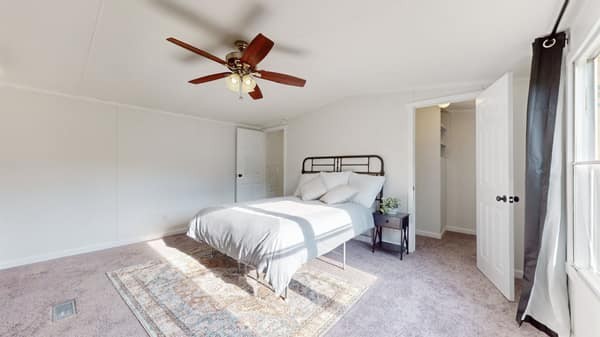 1051 Brandon Hollow Road Lynchburg, TN 37352 - Photo 14 of 36 a bedroom with a bed and a window