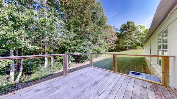 1051 Brandon Hollow Road Lynchburg, TN 37352 - Photo 5 of 36 a view of a balcony with wooden floor
