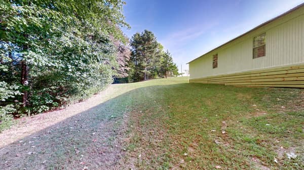 1051 Brandon Hollow Road Lynchburg, TN 37352 - Photo 7 of 36 a backyard of a house with lots of green space