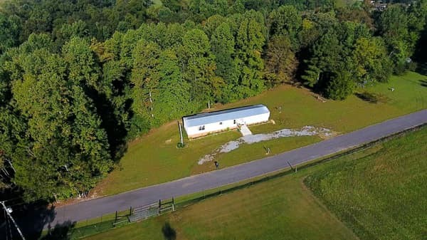 1051 Brandon Hollow Road Lynchburg, TN 37352 - Photo 8 of 36 an aerial view of a house with a yard