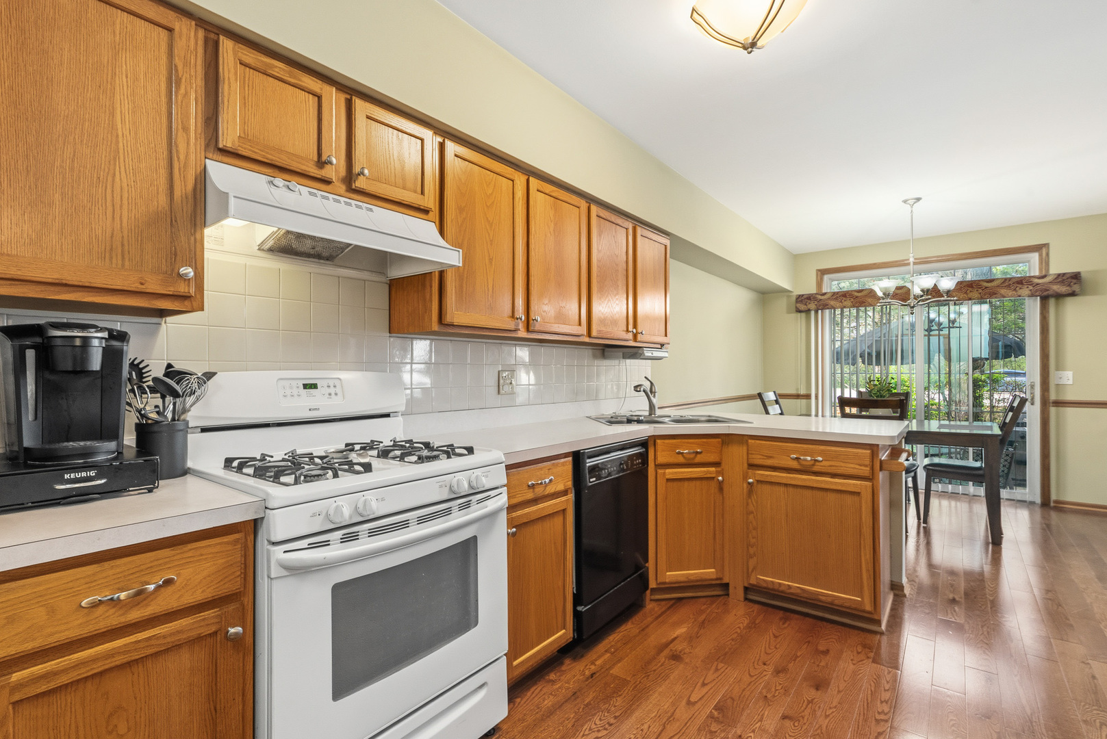 16719 South Sunset Ridge Court Lockport, IL 60441 - Photo 2 of 31 a kitchen with a stove a sink and a refrigerator