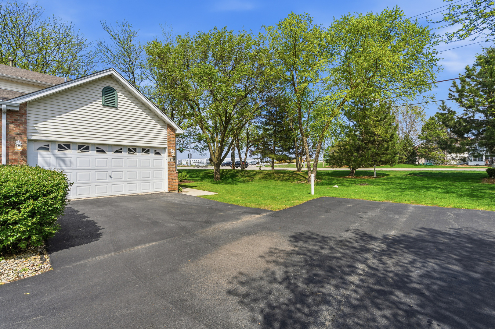 16719 South Sunset Ridge Court Lockport, IL 60441 - Photo 31 of 31 a view of a house with a yard and garage