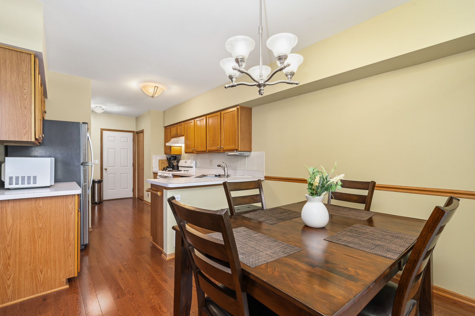 16719 South Sunset Ridge Court Lockport, IL 60441 - Photo 6 of 31 a view of a dining room with furniture and wooden floor