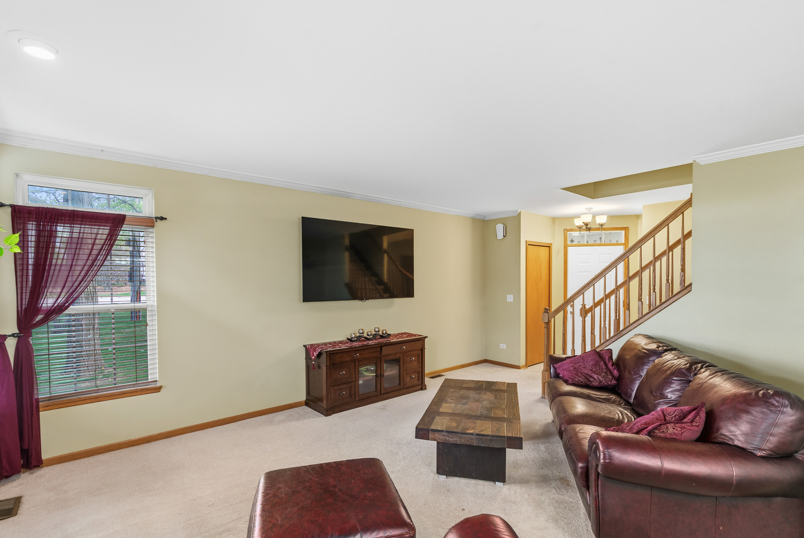 16719 South Sunset Ridge Court Lockport, IL 60441 - Photo 10 of 31 a living room with furniture and a flat screen tv