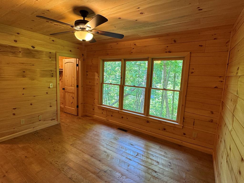 639 North Moreland Drive Blue Ridge, GA 30513 - Photo 50 of 53 a view of an empty room with a window and wooden floor