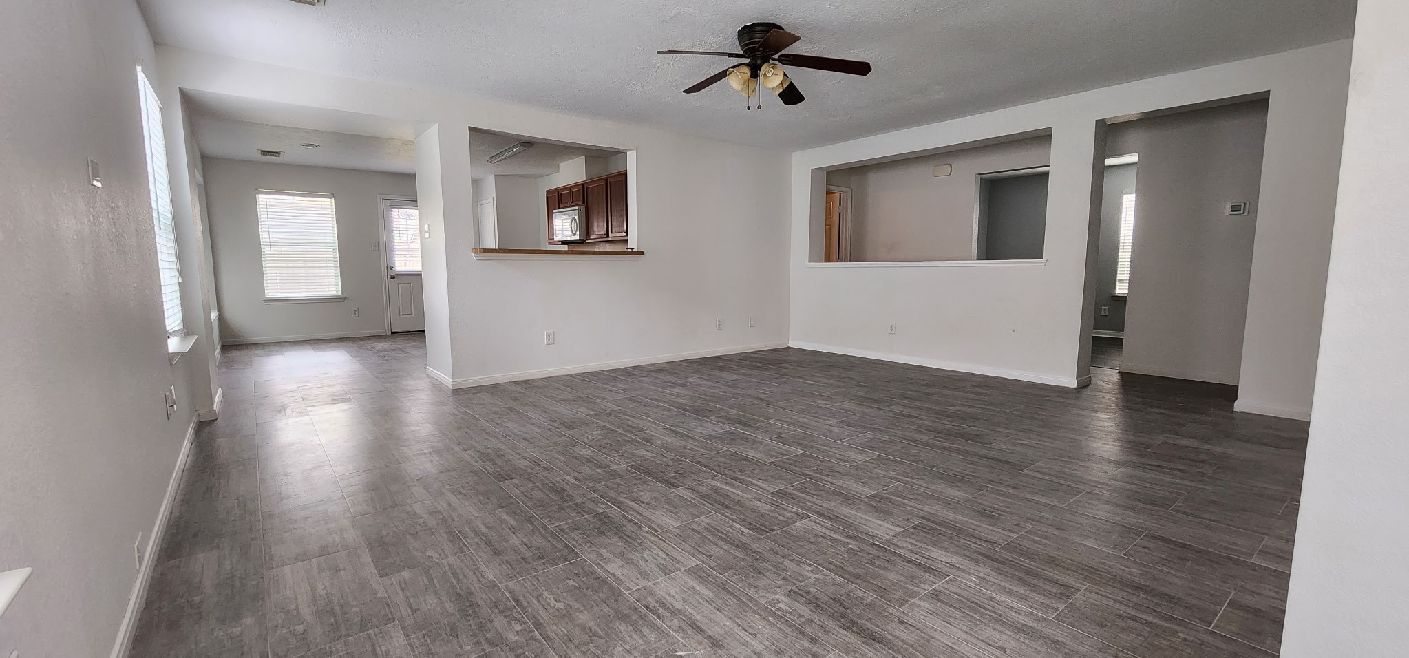 3411 Legends Wild Drive Spring, TX 77386 - Photo 3 of 10 a view of empty room with wooden floor and windows