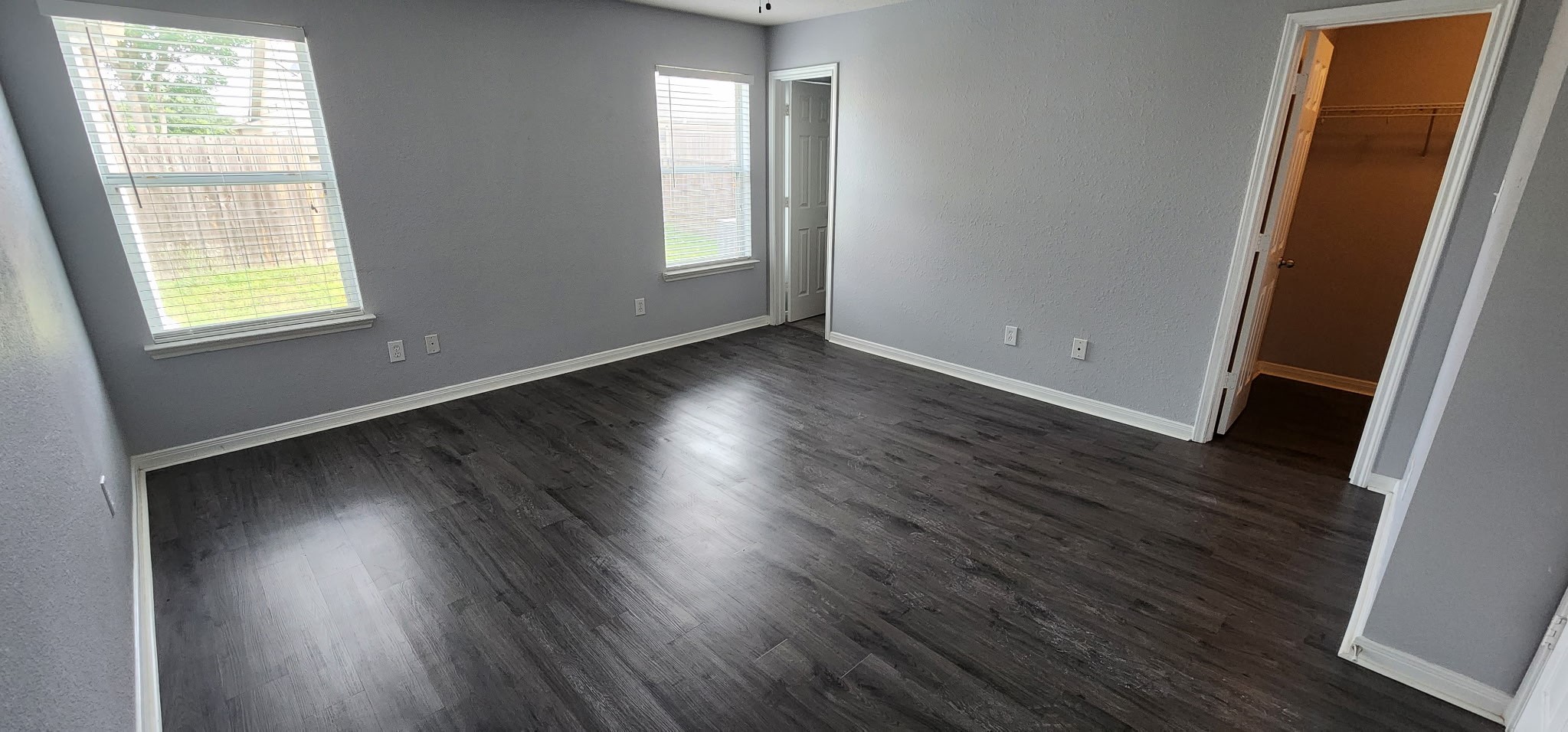 3411 Legends Wild Drive Spring, TX 77386 - Photo 5 of 10 an empty room with wooden floor and windows