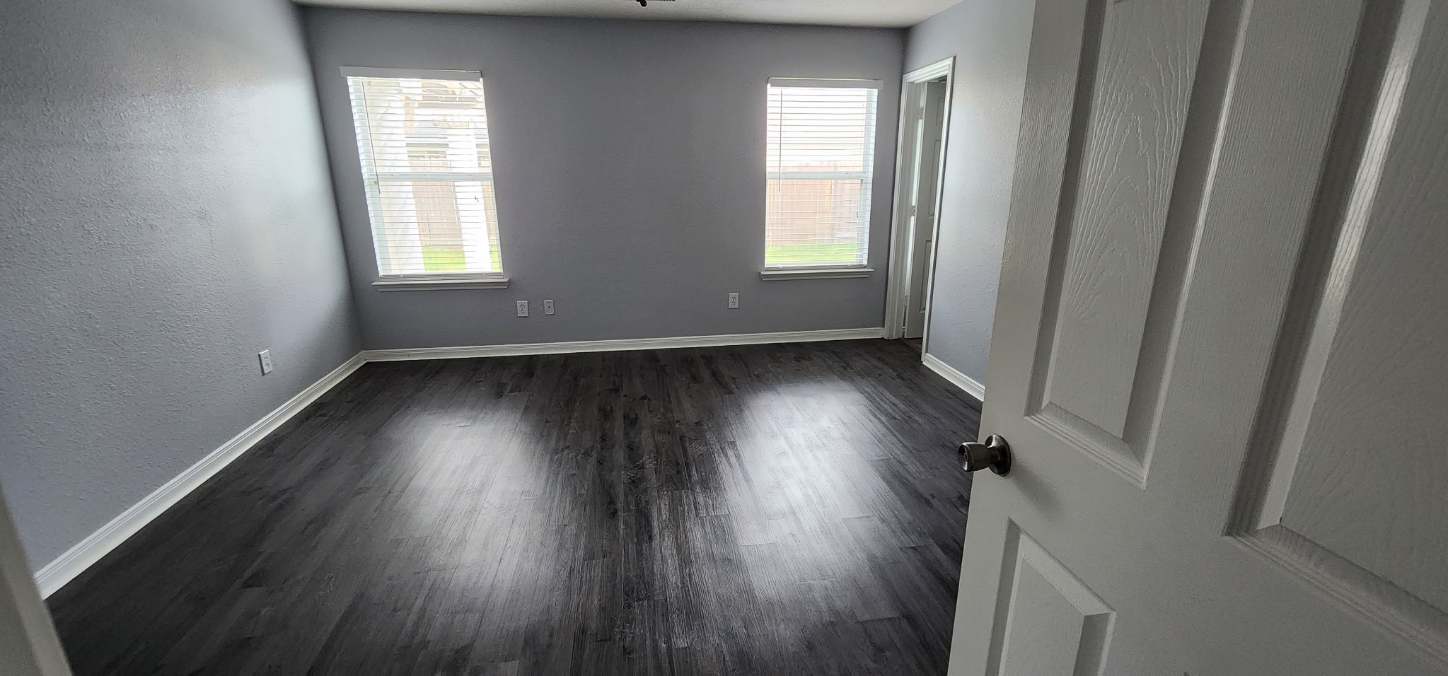 3411 Legends Wild Drive Spring, TX 77386 - Photo 7 of 10 an empty room with wooden floor and windows