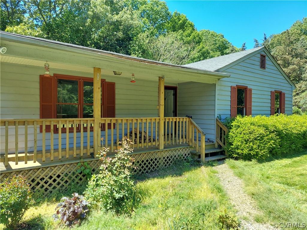 4263 Broad St Road Gum Spring, VA 23065 - Photo 1 of 39 a view of a house with wooden fence and a bench