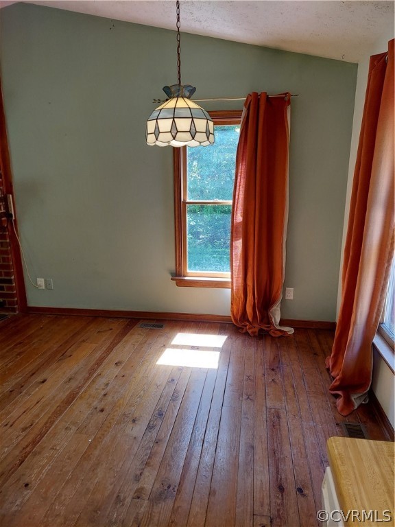 4263 Broad St Road Gum Spring, VA 23065 - Photo 11 of 39 a view of a room with wooden floor and chandelier