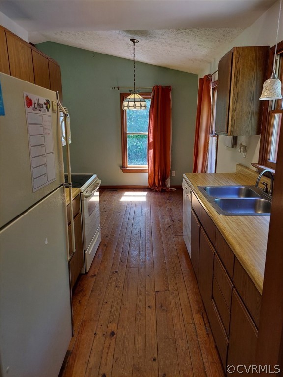 4263 Broad St Road Gum Spring, VA 23065 - Photo 12 of 39 a kitchen with sink a refrigerator and wooden floor