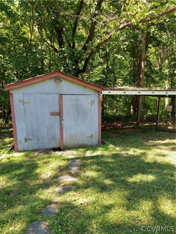 4263 Broad St Road Gum Spring, VA 23065 - Photo 39 of 39 a backyard of a house with lots of green space