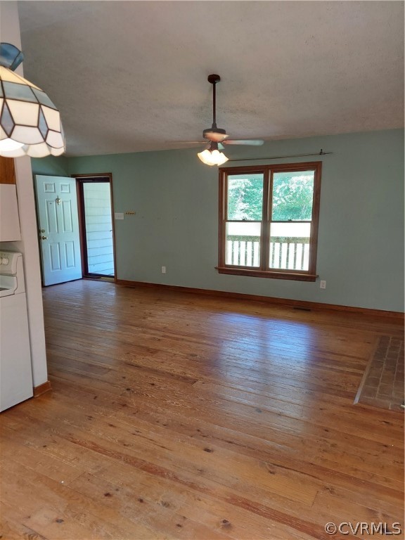 4263 Broad St Road Gum Spring, VA 23065 - Photo 10 of 39 an empty room with wooden floor chandelier and windows