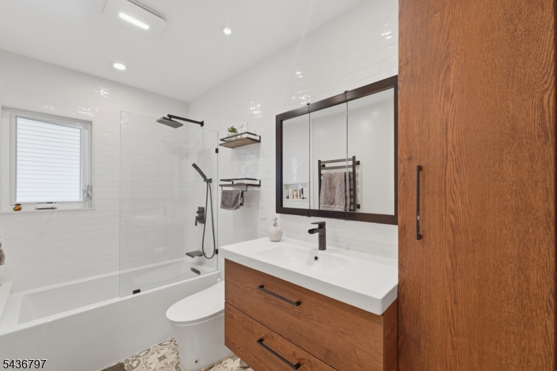 17 Arthur Drive Rutherford, NJ 07070 - Photo 21 of 45 a bathroom with a sink toilet tub and shower