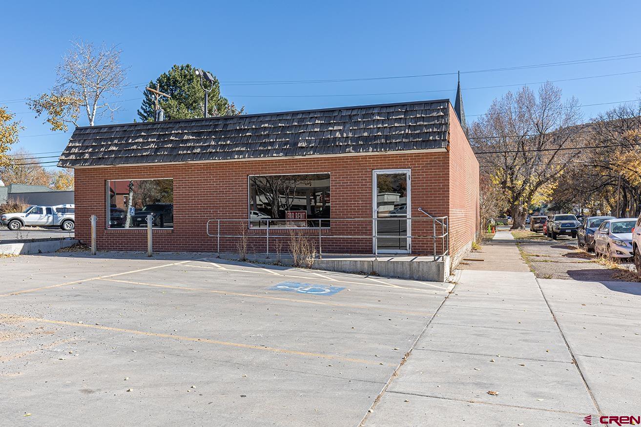 1802 Main Avenue Durango, CO 81301 - Photo 1 of 13 a front view of a house with a yard and garage