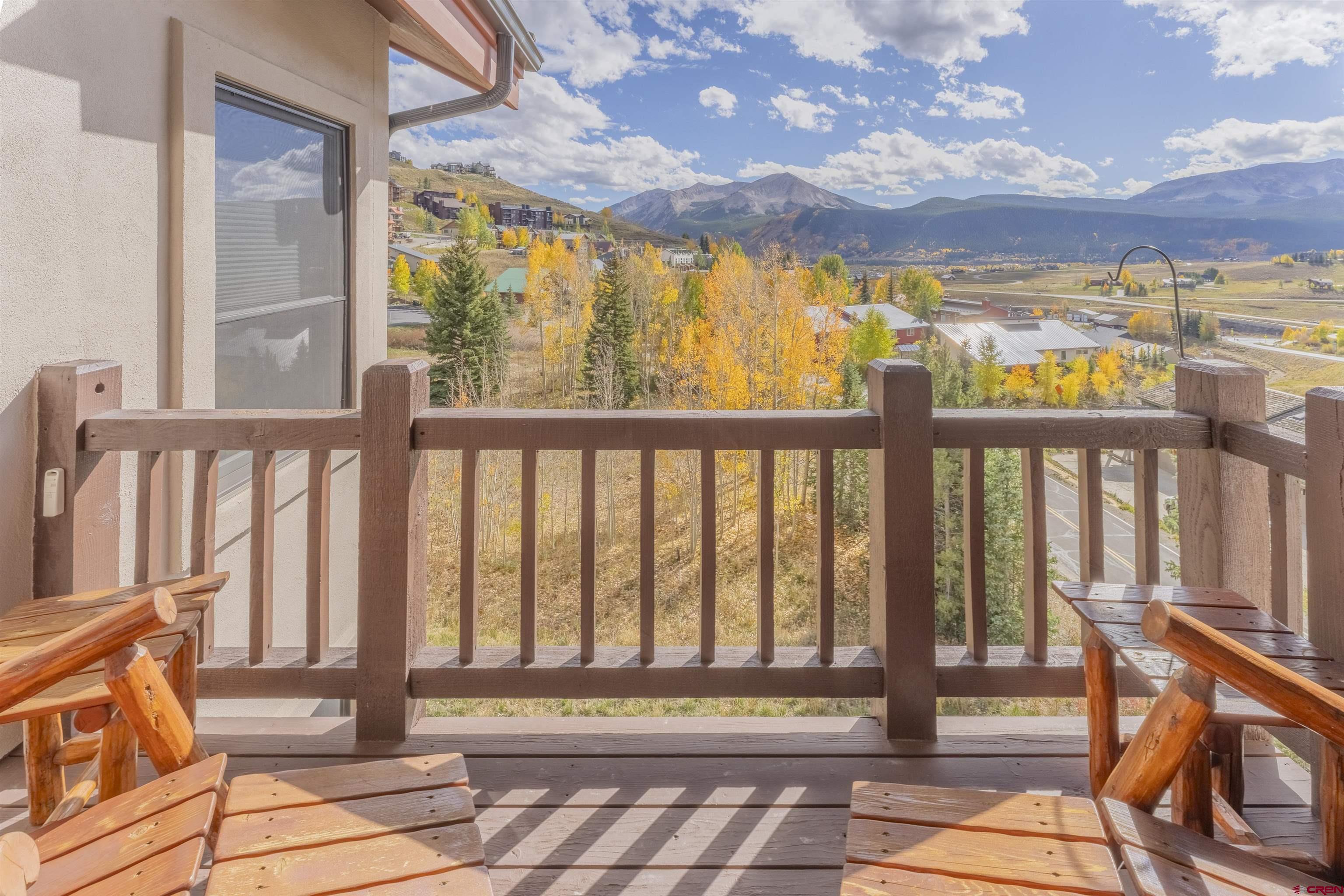 9 Hunter Hill Road, Unit 301 Crested Butte, CO 81225 - Photo 15 of 44 a view of a porch with a bench