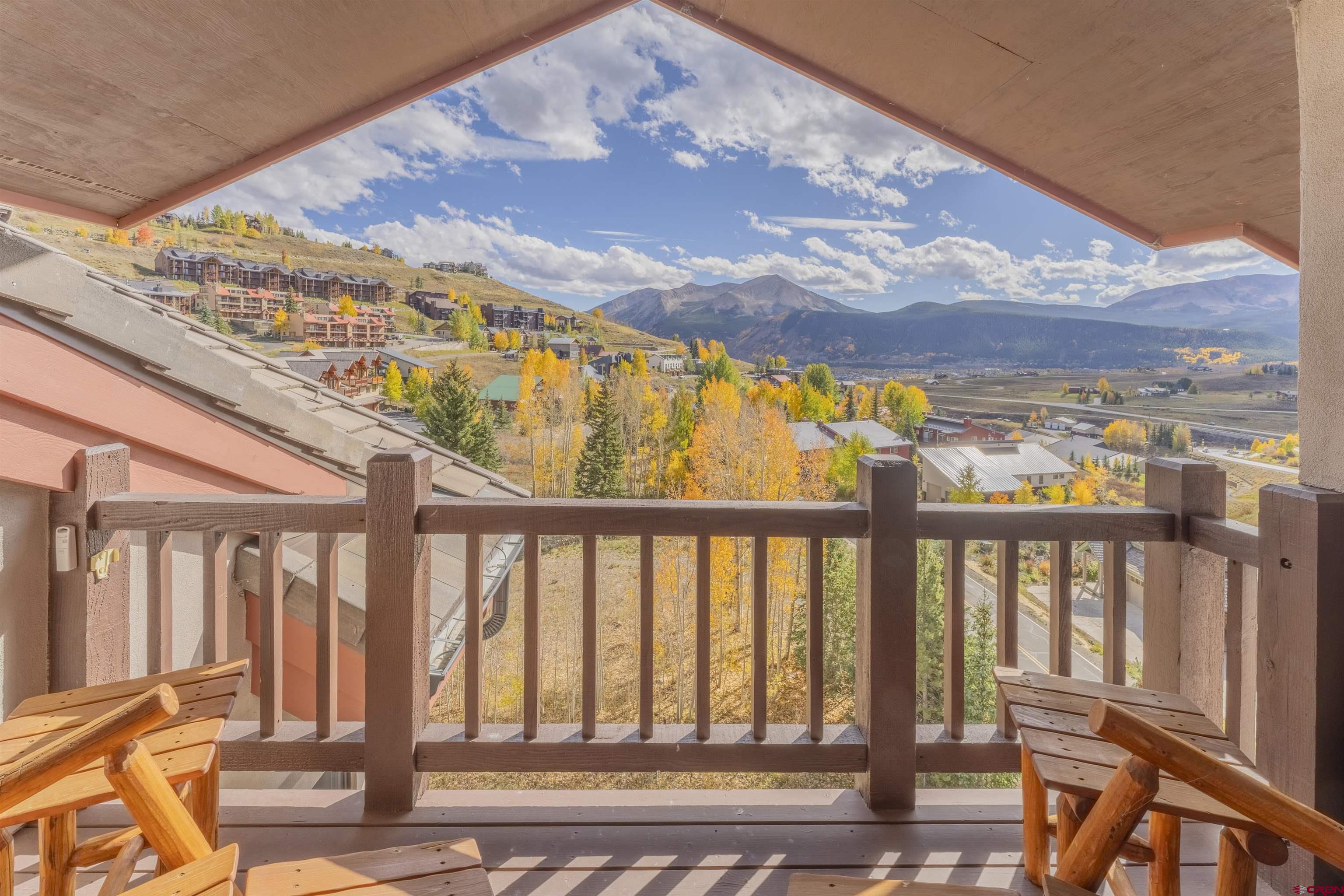 9 Hunter Hill Road, Unit 301 Crested Butte, CO 81225 - Photo 23 of 44 a view of a chairs on the balcony