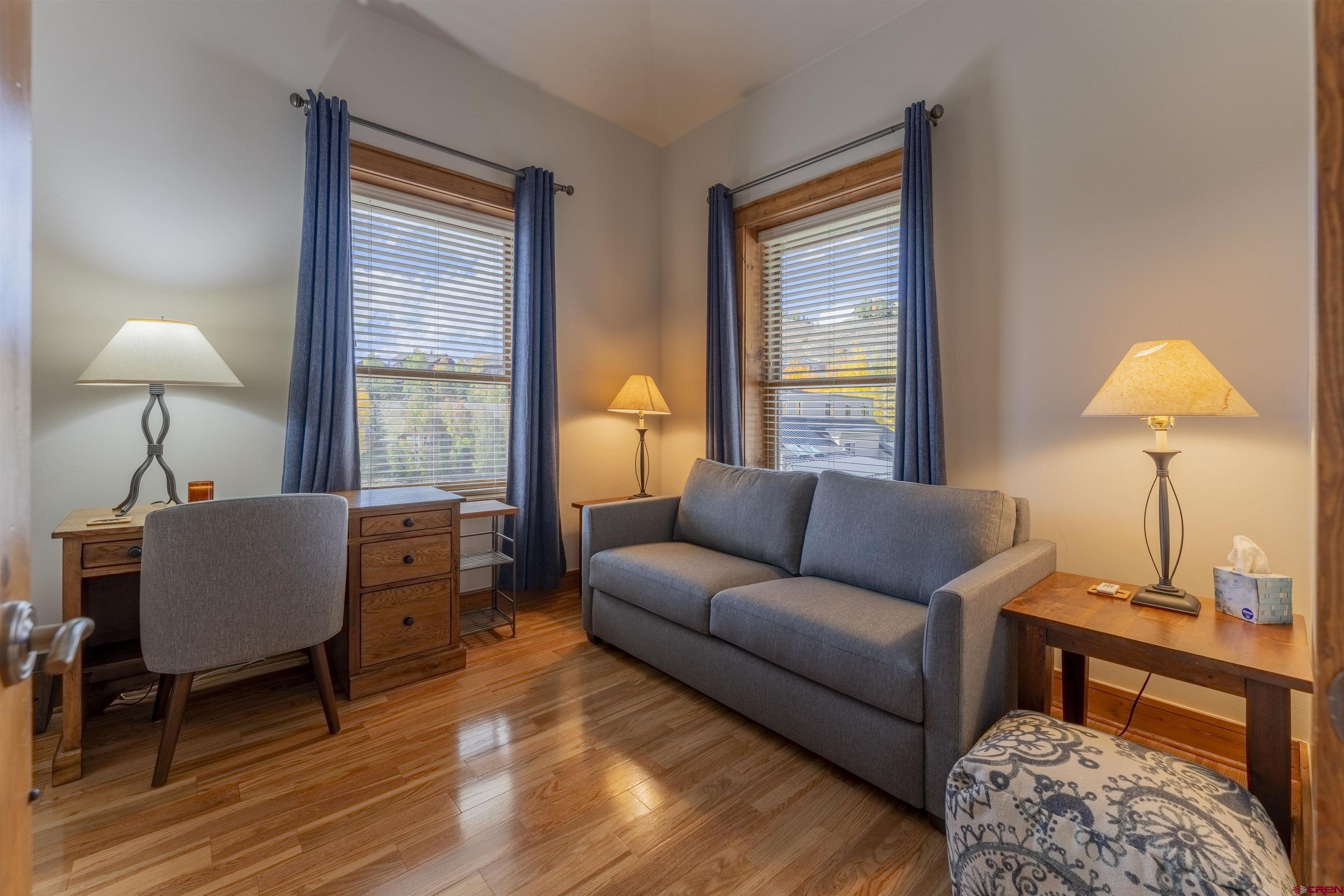 9 Hunter Hill Road, Unit 301 Crested Butte, CO 81225 - Photo 32 of 44 a living room with furniture and a window
