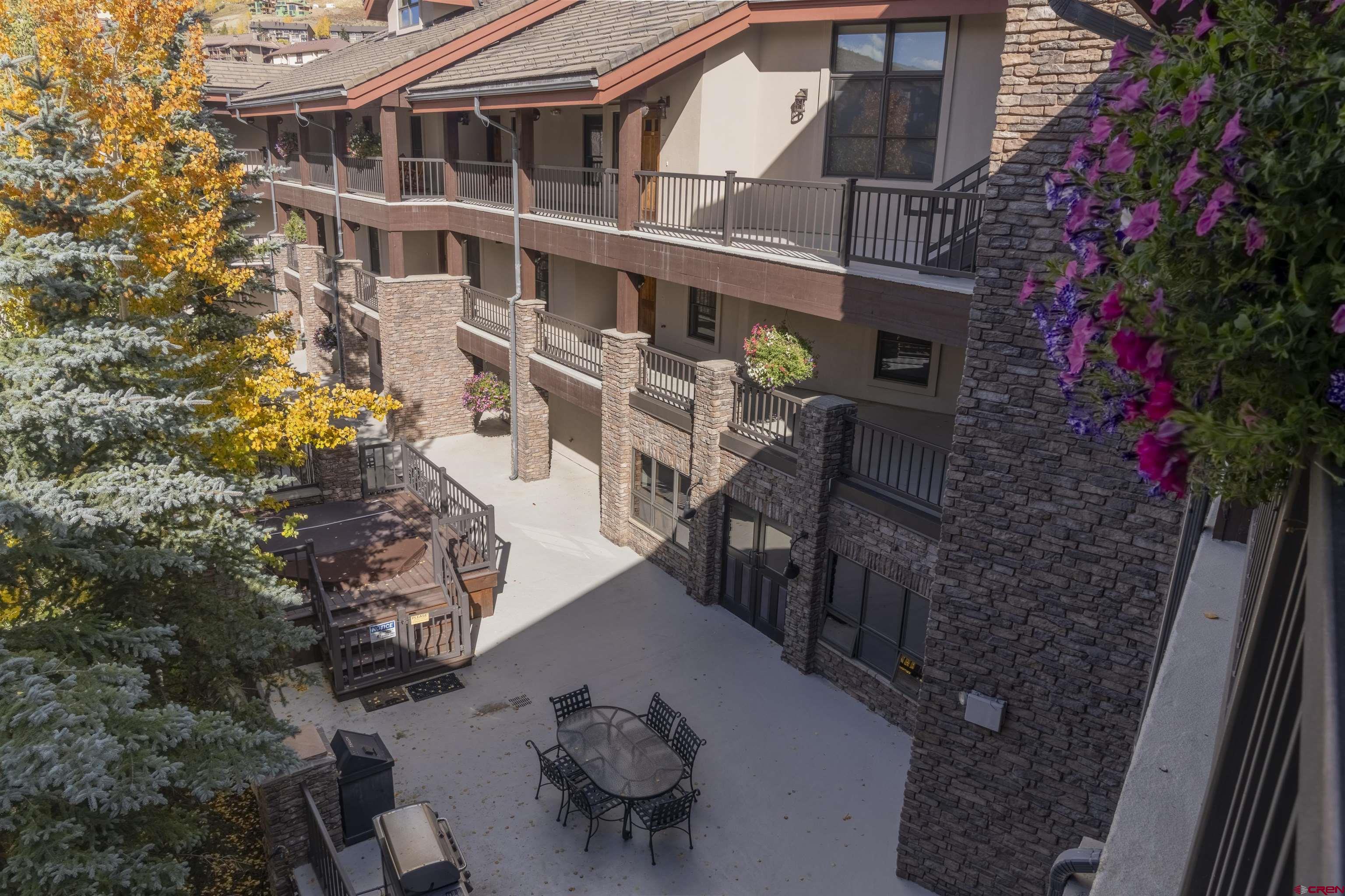 9 Hunter Hill Road, Unit 301 Crested Butte, CO 81225 - Photo 36 of 44 a view of a house with backyard and sitting area