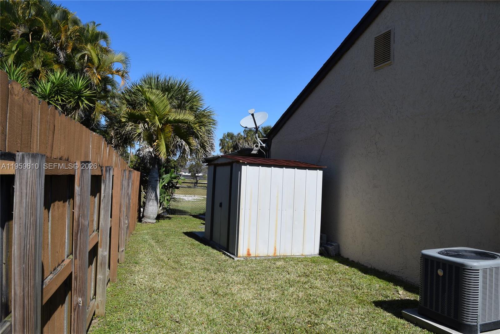 9223 Southwest 130th Street, Unit 9223 Miami, FL 33176 - Photo 12 of 12 a view of a back yard from a corridor