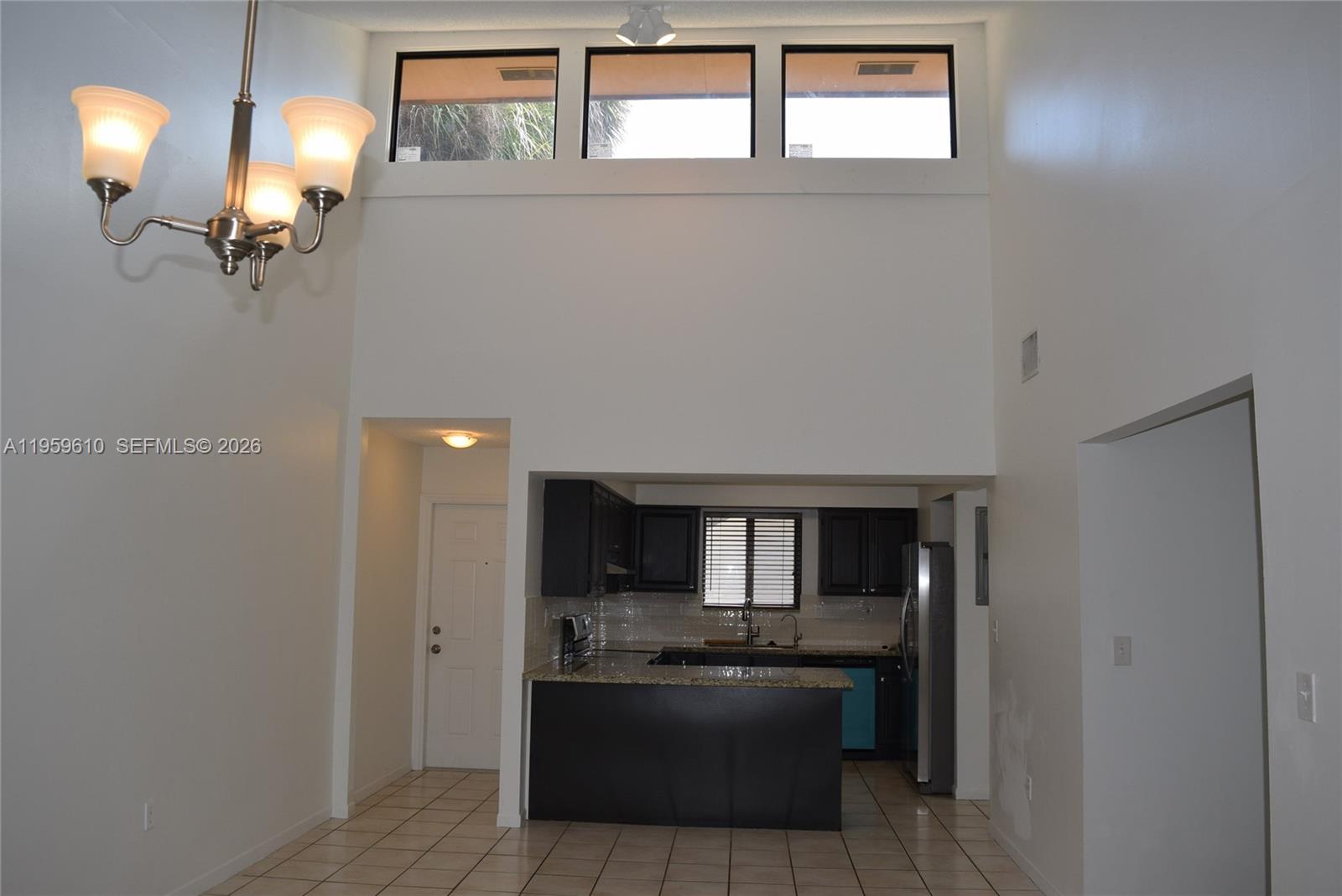 9223 Southwest 130th Street, Unit 9223 Miami, FL 33176 - Photo 3 of 12 a bathroom with a sink and mirror