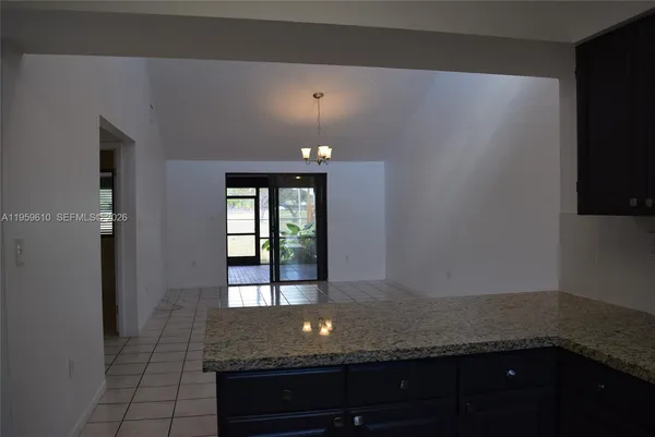 a view of entryway and hall with a wooden floor