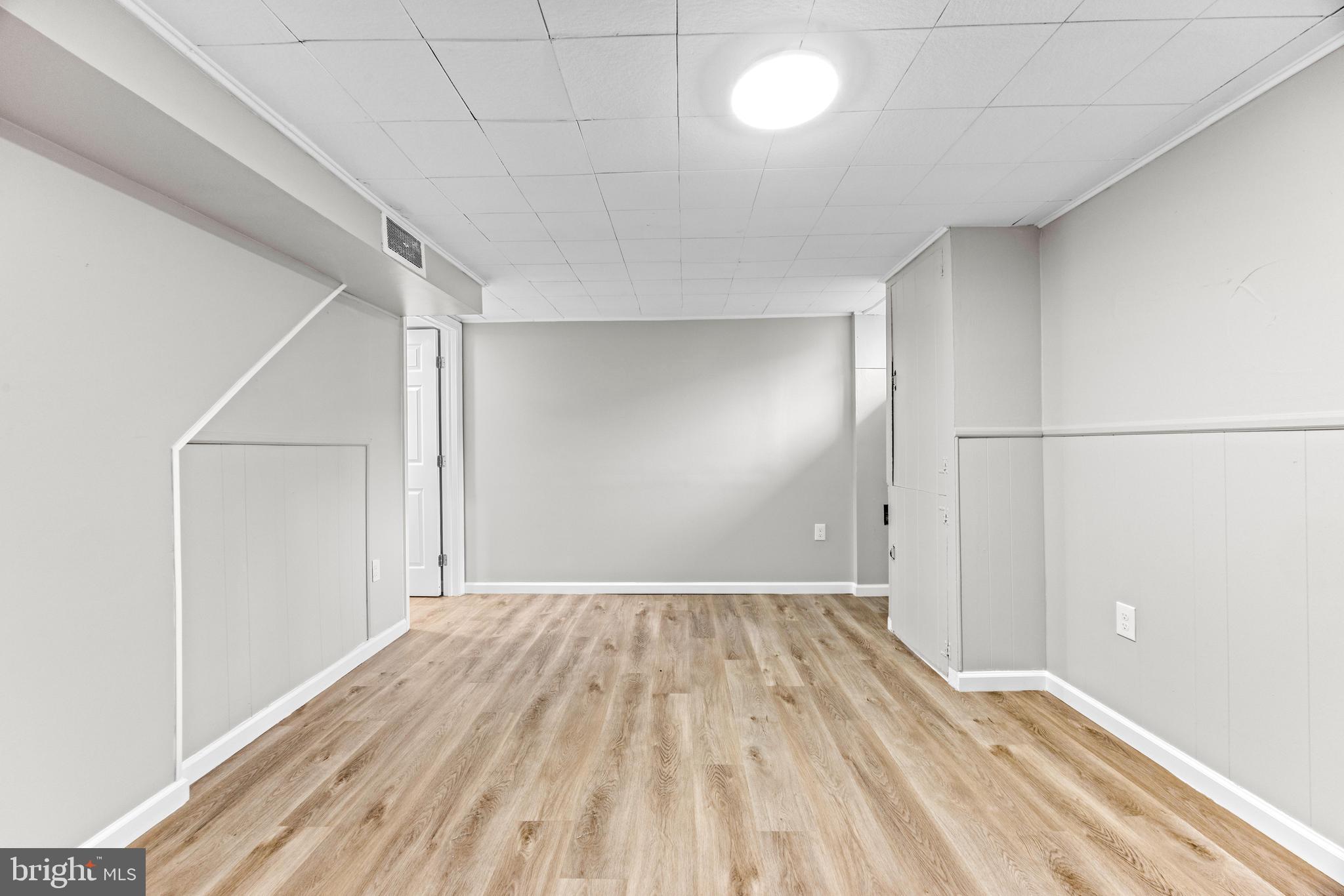 8450 Kavanagh Road Dundalk, MD 21222 - Photo 16 of 32 a view of empty room with wooden floor