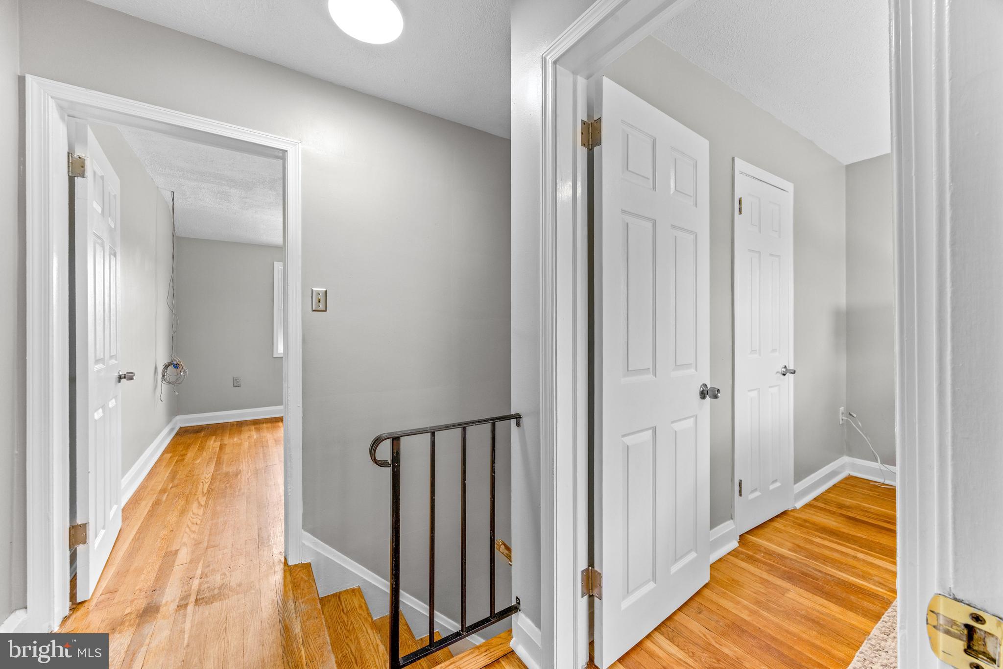 8450 Kavanagh Road Dundalk, MD 21222 - Photo 18 of 32 a view of a hallway with wooden floor and staircase