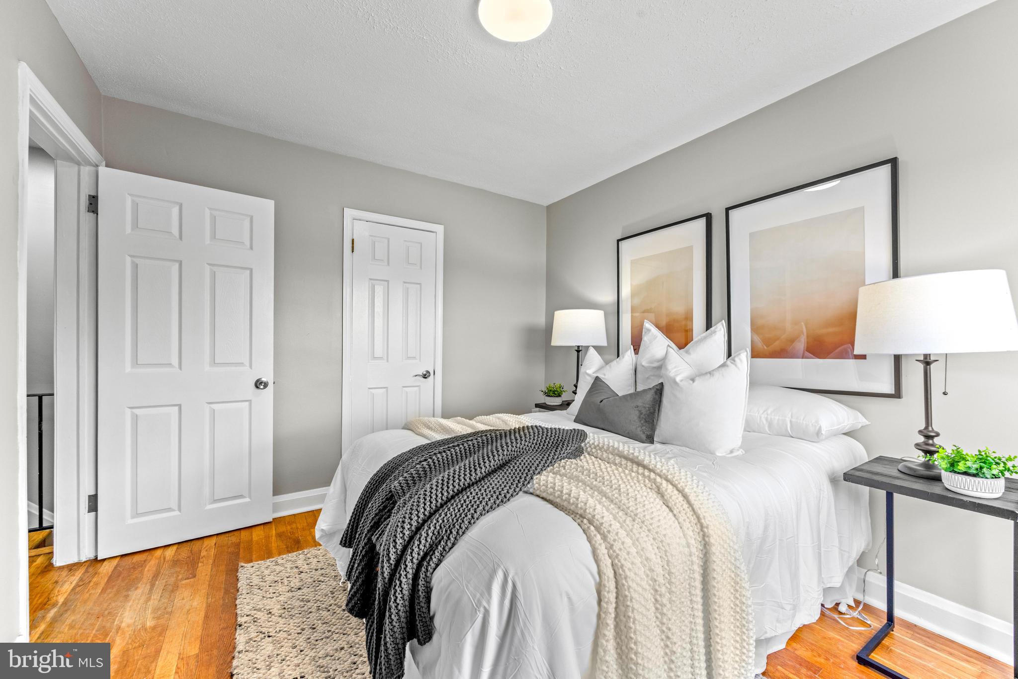 8450 Kavanagh Road Dundalk, MD 21222 - Photo 20 of 32 a bedroom with a bed and a lamp