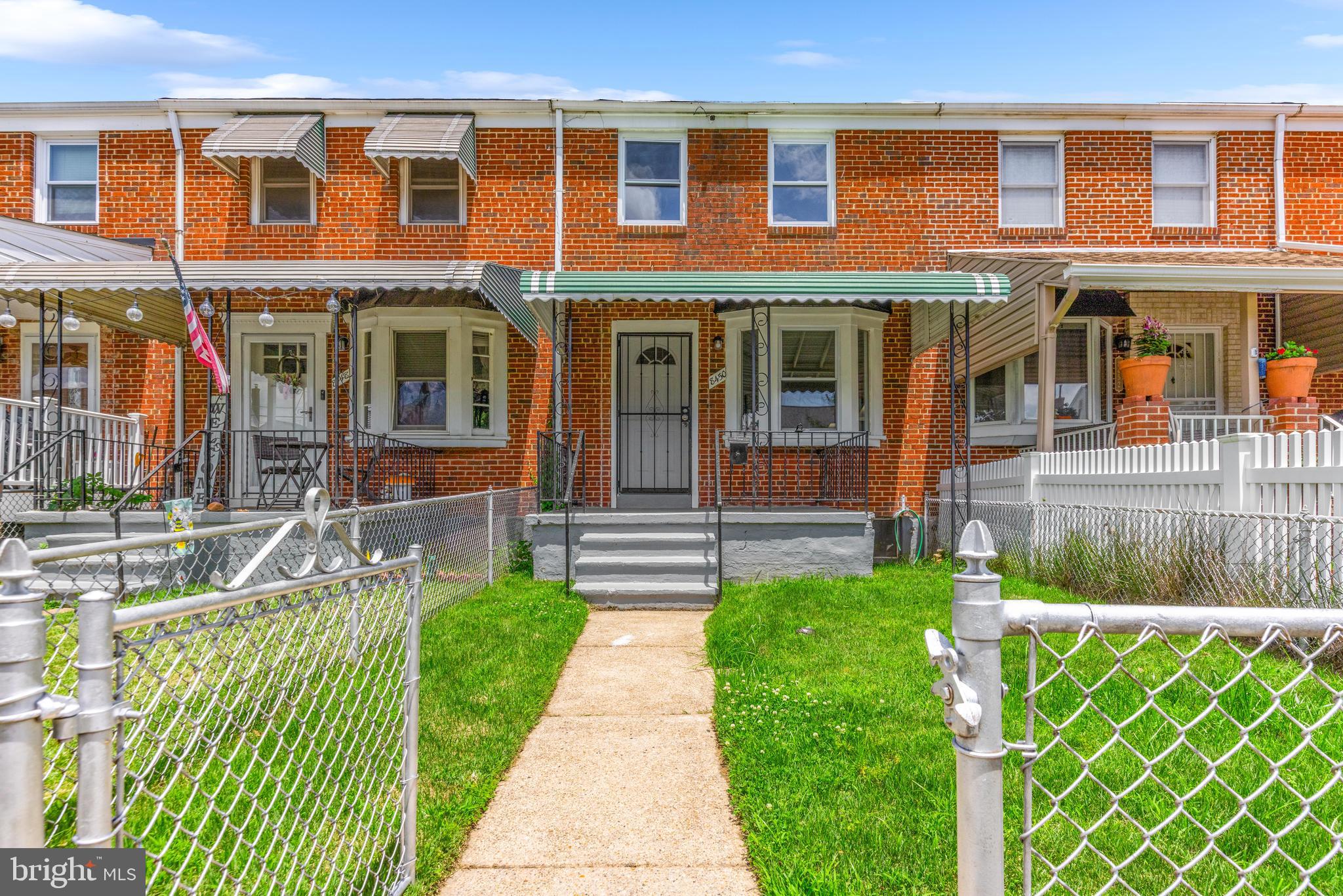 8450 Kavanagh Road Dundalk, MD 21222 - Photo 2 of 32 a front view of a house with a yard