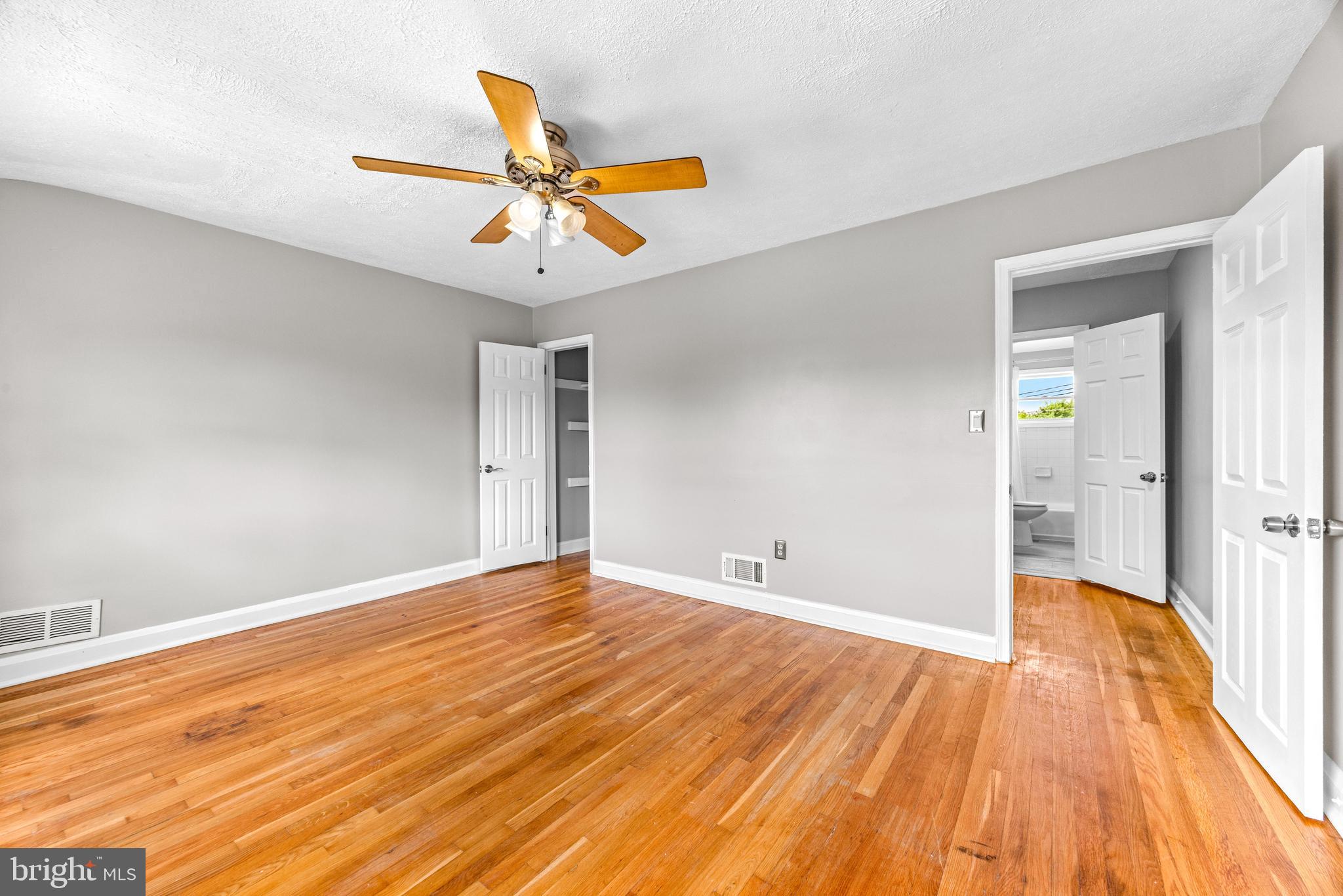 8450 Kavanagh Road Dundalk, MD 21222 - Photo 22 of 32 a view of empty room with wooden floor