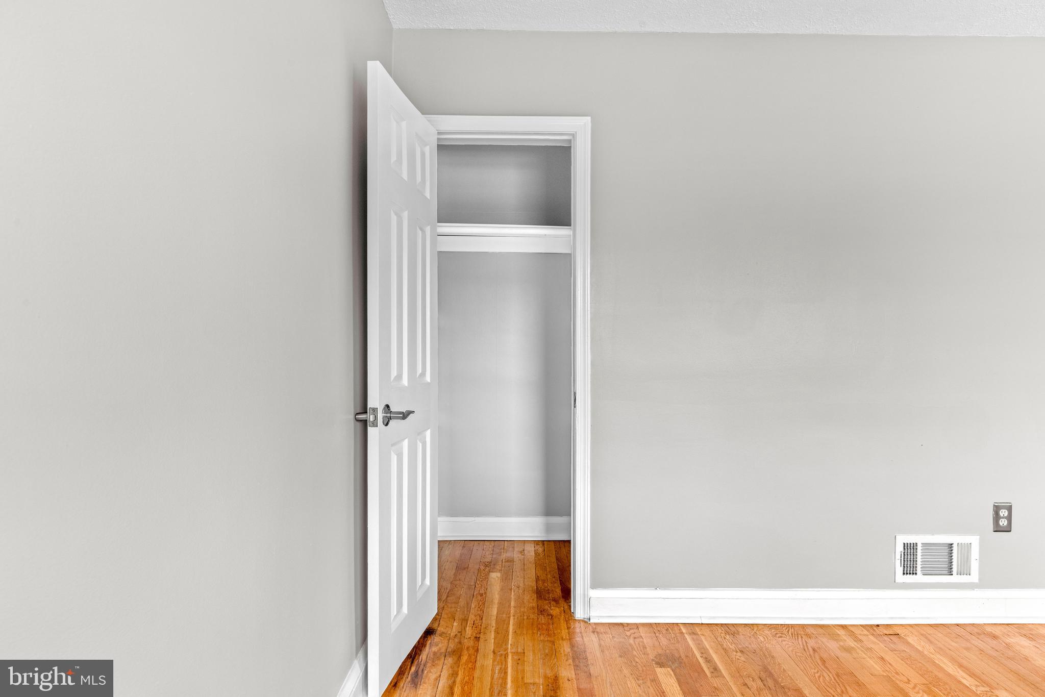 8450 Kavanagh Road Dundalk, MD 21222 - Photo 23 of 32 a view of a bedroom with wooden floor