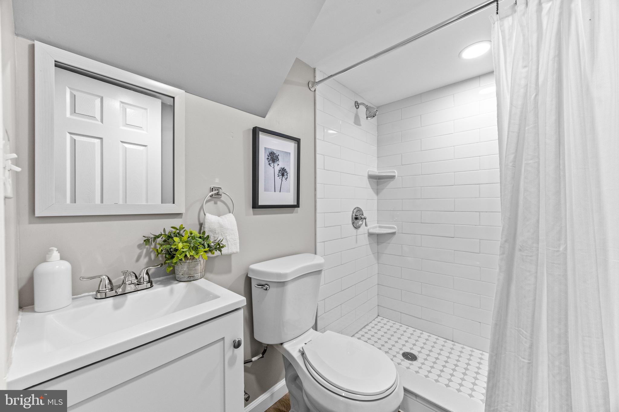 8450 Kavanagh Road Dundalk, MD 21222 - Photo 24 of 32 a white toilet sitting next to a bathroom sink