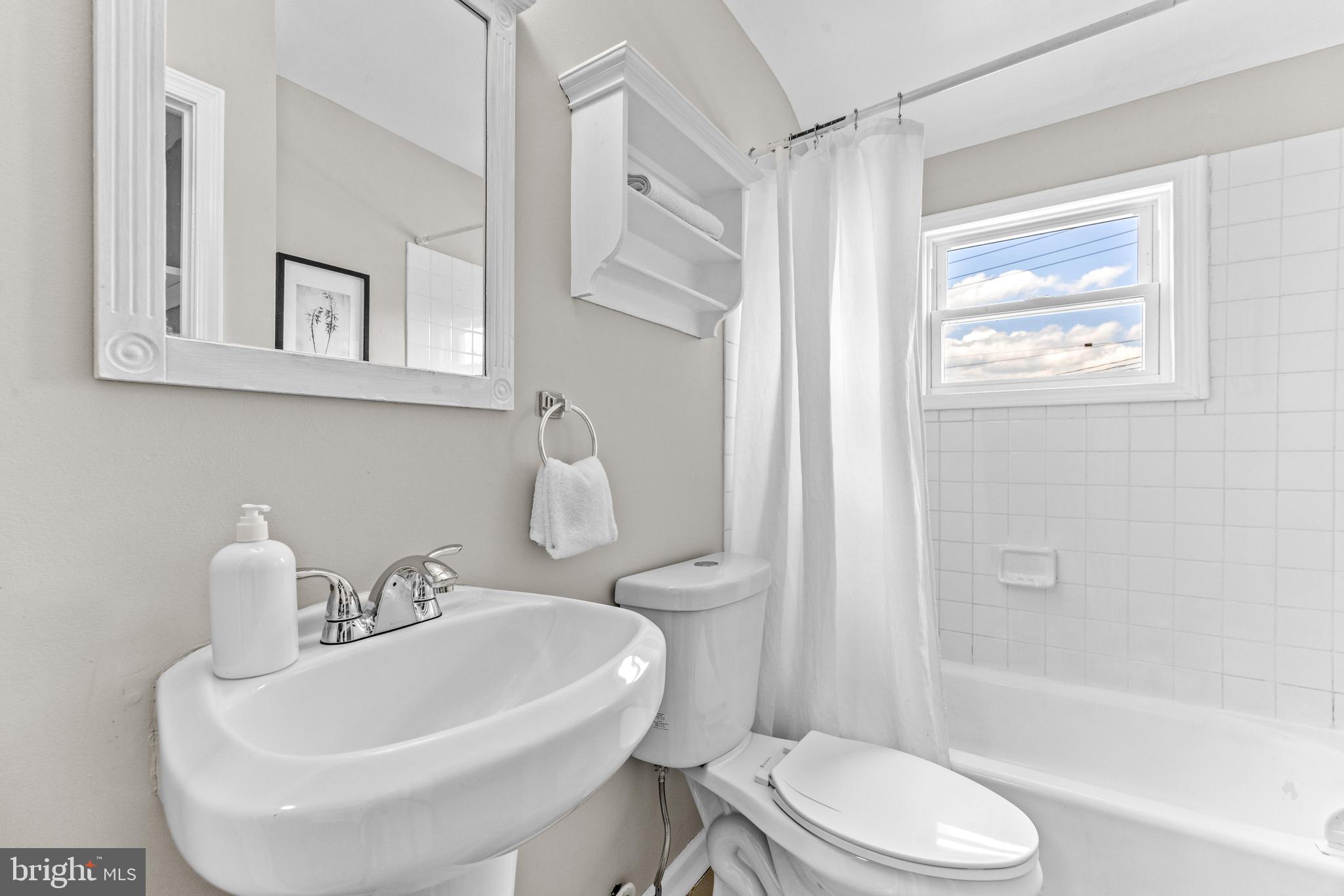 8450 Kavanagh Road Dundalk, MD 21222 - Photo 26 of 32 a bathroom with a sink toilet and shower