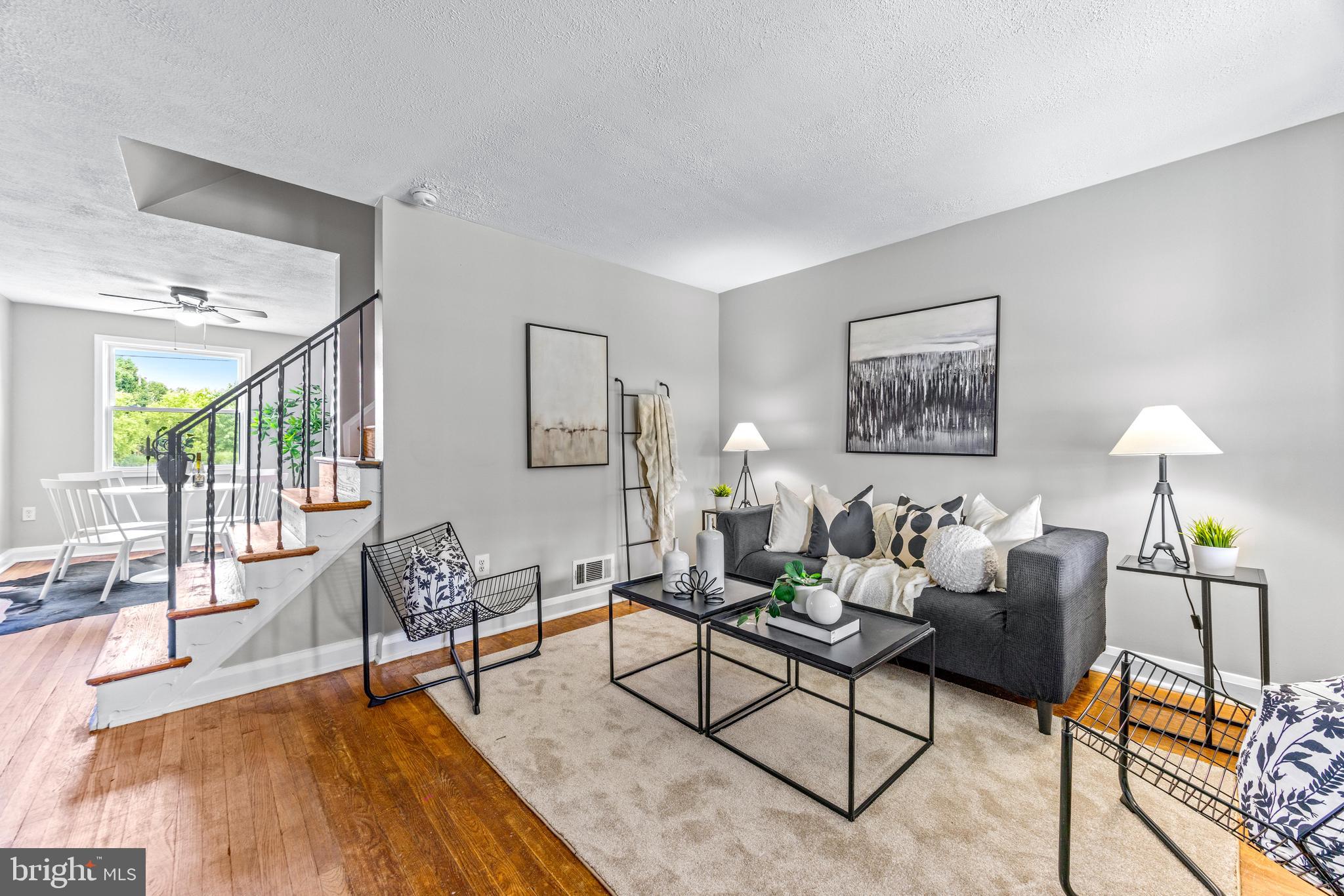 8450 Kavanagh Road Dundalk, MD 21222 - Photo 4 of 32 a living room with furniture and wooden floor