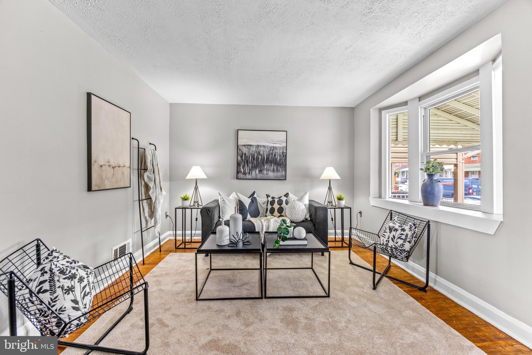 8450 Kavanagh Road Dundalk, MD 21222 - Photo 7 of 32 a living room with furniture a rug and a window