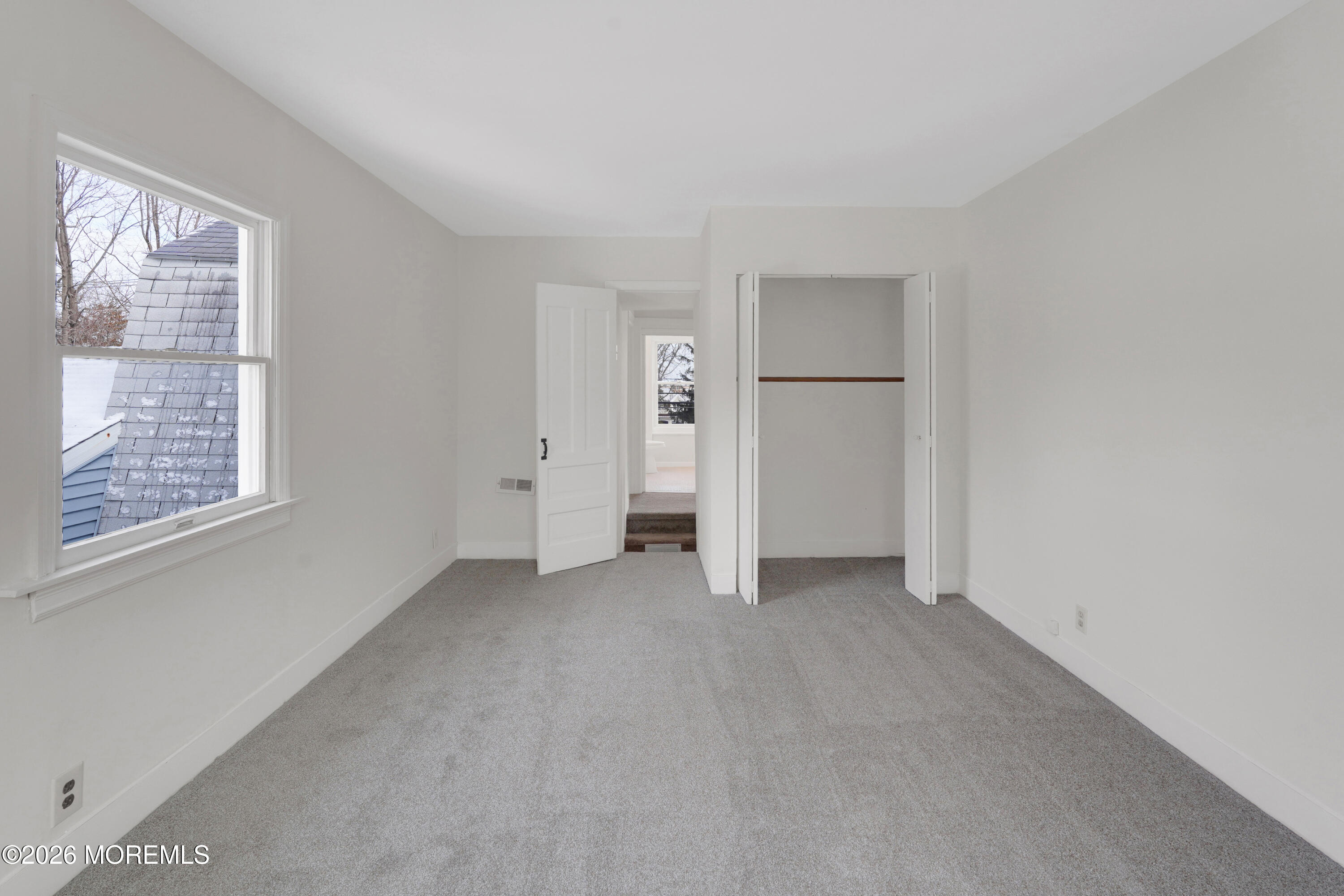 1527 Marconi Road Wall, NJ 07719 - Photo 11 of 25 an empty room with windows and closet